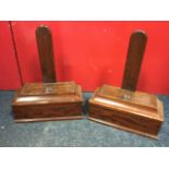 A pair of nineteenth century mahogany plate stands, with rectangular moulded and weighted blocks