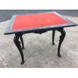 An ebonised Victorian chinoiserie card table, the twin moulded top with baize interior having frieze