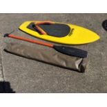 A Hydroslide paddle board with paddle; and a bagged military officers canvas camp bed. (3)