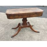 A George IV mahogany turn-over-top card table, the crossbanded top having baize lined interior above