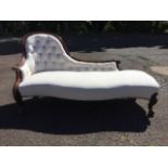 A Victorian mahogany chaise, the scroll carved moulded frame having button upholstered back above