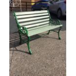 A small restored garden bench with new slats to back & seat, the painted cast iron ends with pierced