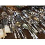 A large quantity of silver plated flatware - many sets, some cased, chrome, knives, forks, spoons,