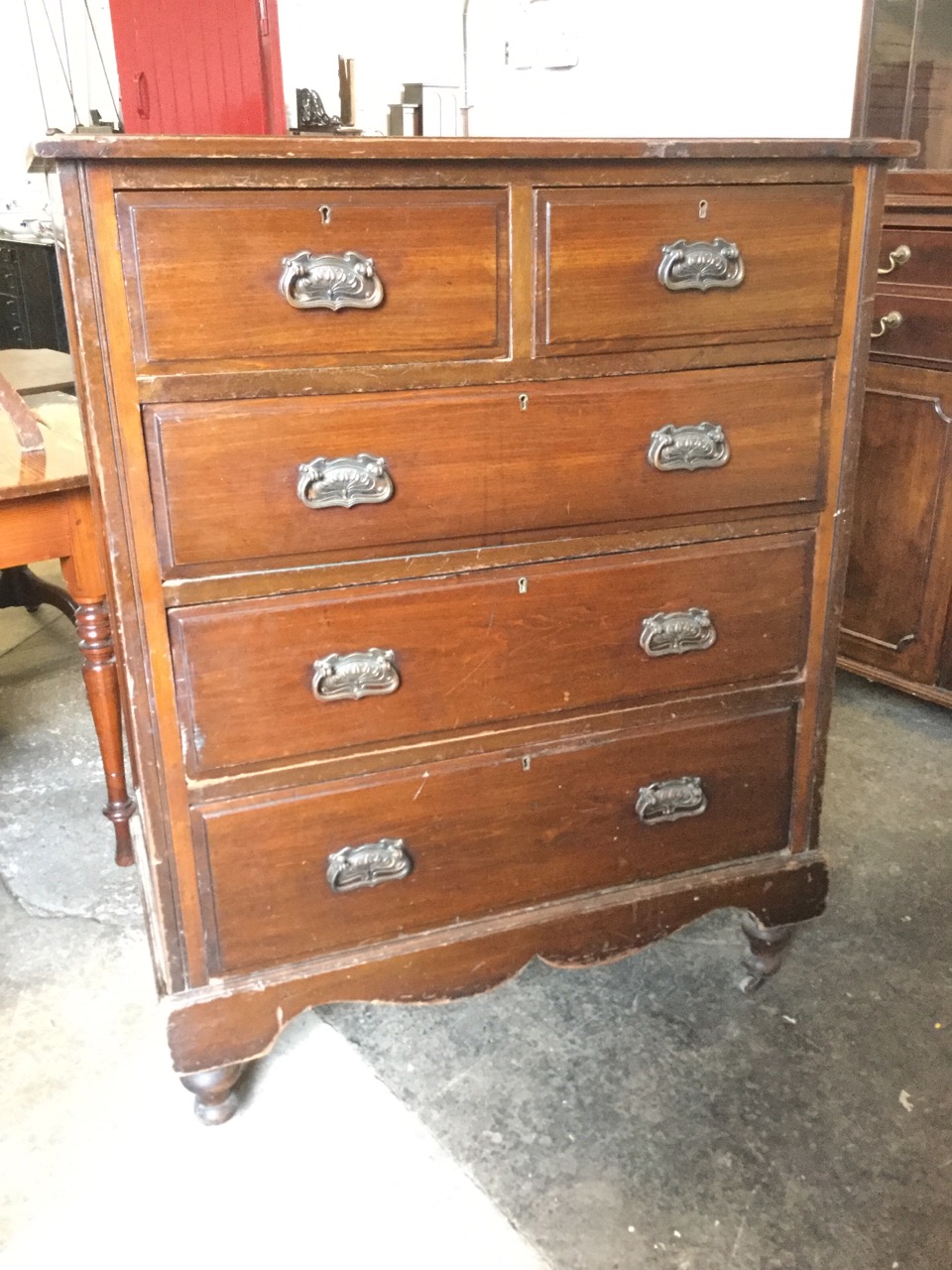 A late Victorian chest of two short above three long graduated drawers, mounted with original art