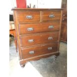 A late Victorian chest of two short above three long graduated drawers, mounted with original art