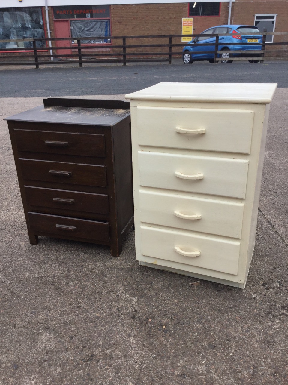 A painted chest of four drawers with curved handles; and another chest of four drawers with