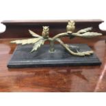 Brass, two owls on leafed branch, mounted on rectangular ebonised plinth. (9in)