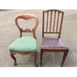 A Victorian mahogany balloon back dining chair with scroll carved joining rail above an