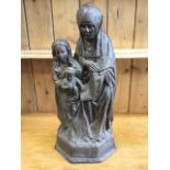 An eighteenth century oak carving of the holy group on hexagonal plinth, Mary & Jesus beside a