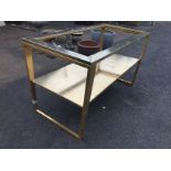 A rectangular gold painted metal counter or serving table,