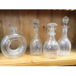 A pair of Georgian mallet shaped decanters with fluted cut octagonal bodies and star bases; a