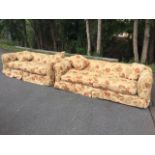 A pair of large country house sofas with rounded padded backs & arms above deep seats and