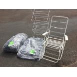 Two folding garden armchairs, one with loose cushions; and a collapsible clothes drier. (3)