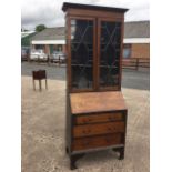 An Edwardian mahogany bureau bookcase, overall crossbanded in satinwood framed by boxwood & ebony