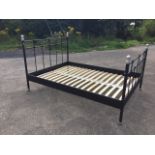 An Ikea painted tubular metal modern double bed, the cornerposts with silvered