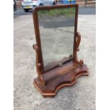 A large Victorian mahogany dressing table mirror, the rectangular plate in cushion moulded frame