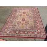 A Valby Ruta oriental style rug, woven in Egypt with field of 35 rectangular floral panels, the