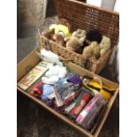 A Fortnum & Masons cane hamper containing a collection of teddies, soft toys, monkeys, etc; and a