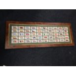 A framed set of Players cigarette cards, the 50 cards depicting flags of the League of Nations,