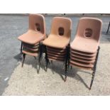 A set of eighteen stacking chairs, the child size seats on metal frames. (18)