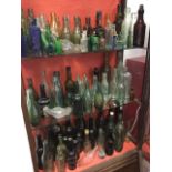A collection of antique bottles, many dug-up types - beer with examples from Kelso, Edinburgh,
