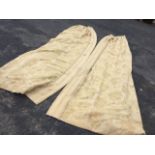 A pair of lined & interlined linen curtains, the brocade type material embossed with floral