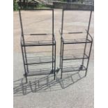 A pair of plant pot trolleys, each with three rectangular grill shelves. (25.5in x 15in x 53.5in) (