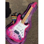 A childs soft cased Candy Box electric guitar. (35.5in)