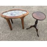A Victorian oval scalloped and moulded rosewood tray with beadwork panel, mounted on later legs to