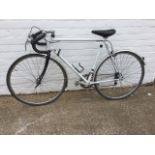 A Triumph racing bicycle with drop handlebars, Weinman brakes, shaped seat, Chorus gears, etc.