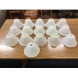 A set of sixteen frosted glass bell shaped lightshades. (6.75in dia) (16)