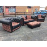 A contemporary leather button upholstered three-piece suite having tapestry aztec style panels and