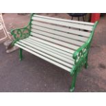 A restored garden bench with new slats to back & seat, the painted cast iron ends with pierced