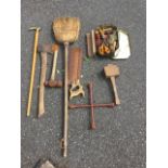 Miscellaneous tools including an axe, a mallet, G-clamps, a walking stick with brass handle, a