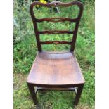 A period mahogany ladderback style chair with pierced rails above a dished seat, supported on square