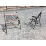A pair of cast iron bench ends with scrolled arms on sabre legs, with one back panel - require re-