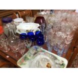 A large quantity of glass including sets of wine glasses, jugs, dessert sets, fruit bowls, a Sowerby