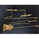 Three brass fire irons - tongs, poker & shovel, together with an associated pair of firedogs with