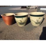 A pair of stoneware garden pots with green glazed scraffito decoration; and another similar salt