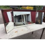 A 70s dressing table mirror in three parts, the plates on angled supports beneath cornice mouldings.