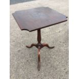 An antique mahogany occasional table, formerly been a snap-top, the square cut-corner top on