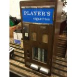 A Players Cigarettes vending machine, the rounded dovetailed case with chrome mounts and glass