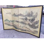 A Chinese four-fold screen, the panels depicting a continuous landscape with figures, with silk band