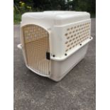 A large Vari-Kennel Ultra animal/dog cage, with chromed grill door, the top half pierced with