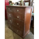 A late Victorian oak chest of drawers, with moulded top above two short and three long graduated