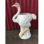A large porcelain jardiniere modelled as an ostrich, the handpainted bird on naturalistic leaf