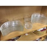 A set of 17 crescent shaped glass side dishes with ribbed cut rims; and a set of 6 fingerbowls