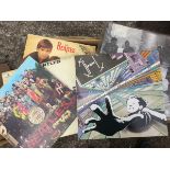 A collection of vinyl records - LPs including Beatles, early jazz, Clash, Moody Blues, Shadows,