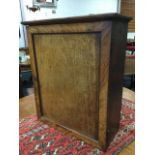 A nineteenth century mahogany medicinal cabinet, with moulded cornice above a panelled door