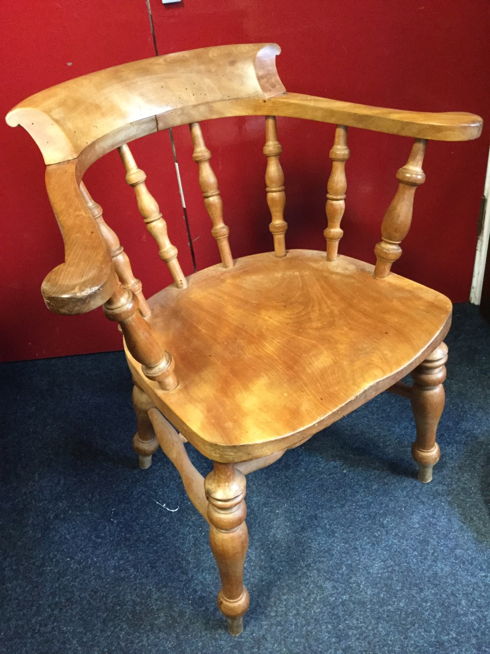 A mahogany captains chair, the shaped bow back on spindles above a solid seat, raised on turned legs - Image 3 of 3